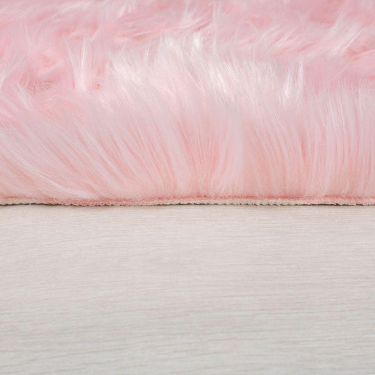 Tapis effet fourrure rose