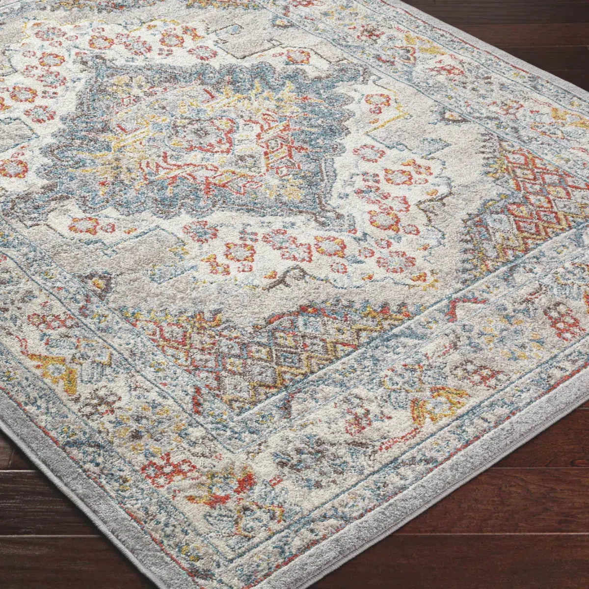 Tapis SURYA Jade oriental, médaillon bleu foncé, touches rouille et moutarde sur fond gris, vue 4