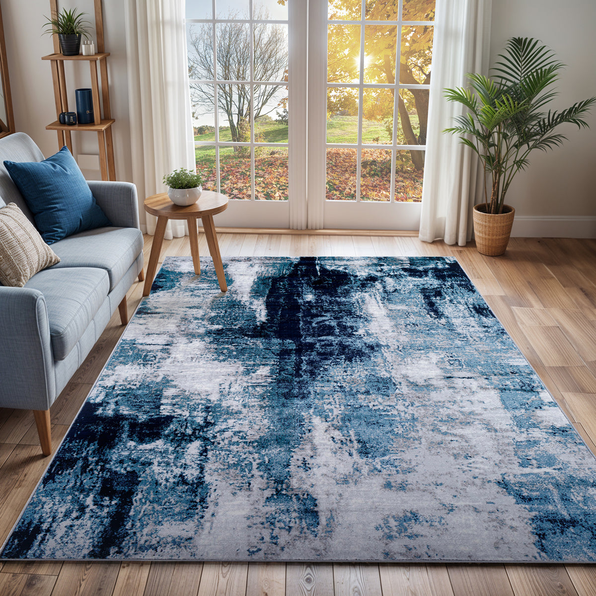 Tapis SURYA Helsinki moderne, motif abstrait façon peinture bleu encre, bleu ciel, gris et blanc