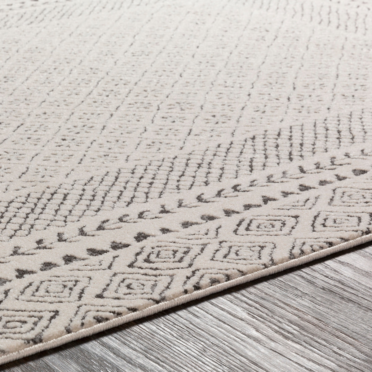 Tapis rond SURYA Monaco géométrique, bordure de losanges anthracite sur fond beige clair, vue 3