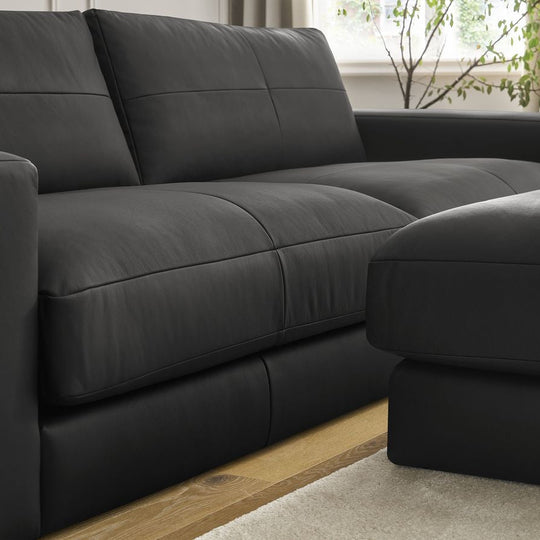 Canapé BOBOCHIC droit fixe 3 places LEONARD cuir de vache avec pouf noir