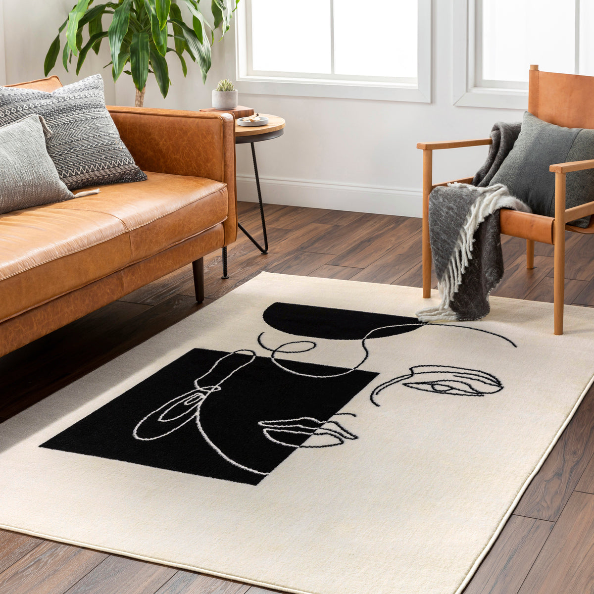 Tapis SURYA Cobo moderne, motif visage en ligne continue noir sur fond écru