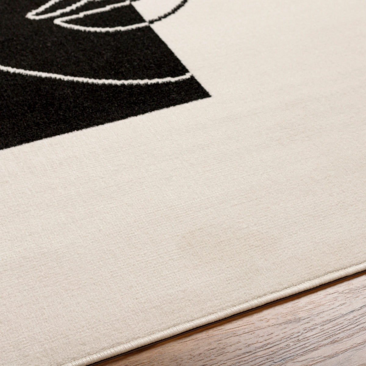 Tapis SURYA Cobo moderne, motif visage en ligne continue noir sur fond écru, vue 3