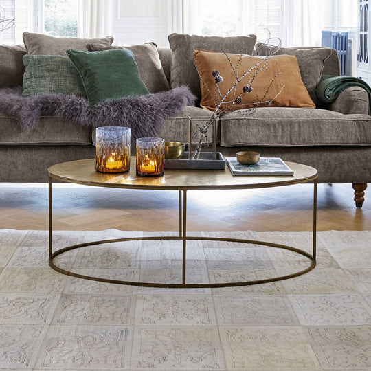 Table basse ovale LOBERON Leron en métal or vieilli — photo produit