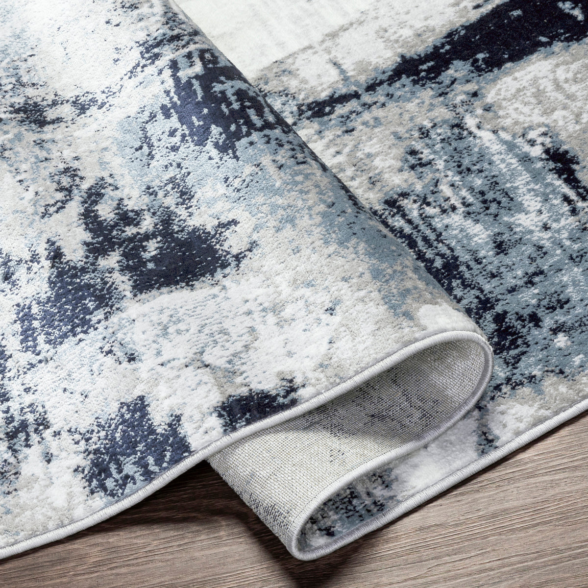Tapis rond SURYA Helsinki moderne, motif abstrait bleu encre et anthracite sur fond blanc, vue 4